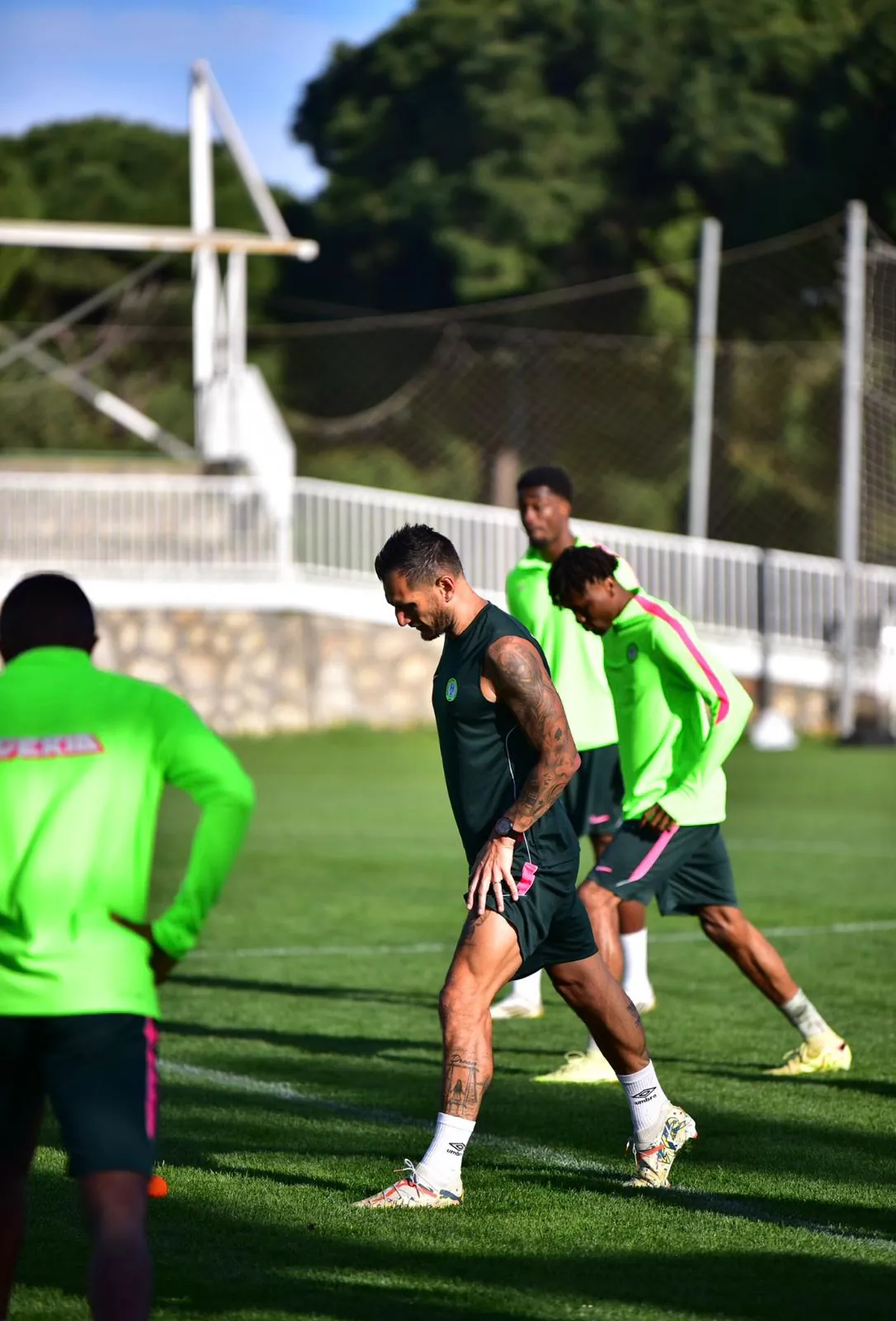 Staff and players during a training session